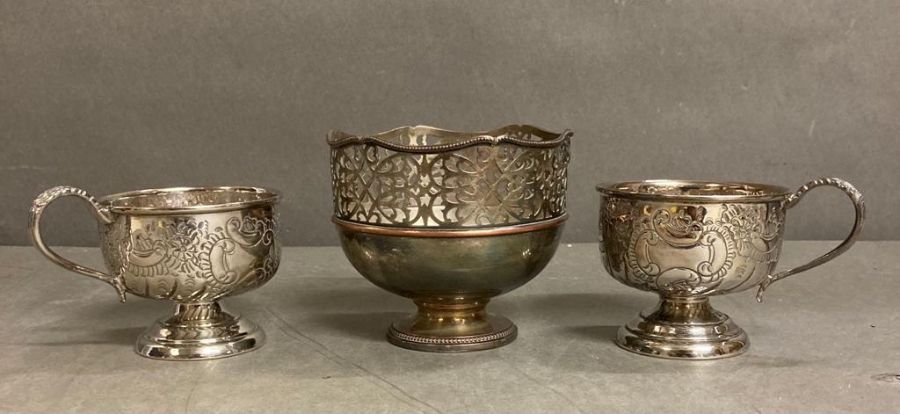 Two silver plated cups and a silver plate pierced bowl