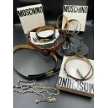 A selection of women's designer belts including Moschino and Armani flip flops