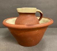 A vintage English slipware wash bowl and jug