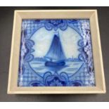 A framed antique Delft tile