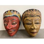 A pair of painted wooden masks, Indonesian in style