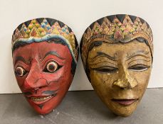 A pair of painted wooden masks, Indonesian in style