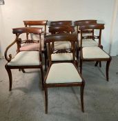 Seven Georgian style mahogany dining chairs and two carvers with scrolling arms