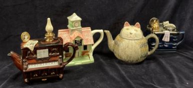 A selection of four novelty teapots