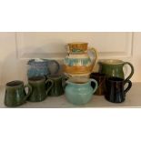 A selection of Studio pottery to include jugs and cups