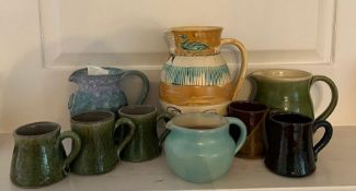 A selection of Studio pottery to include jugs and cups