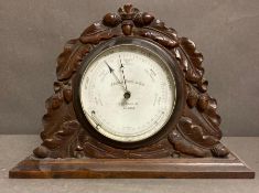 A mantle barometer in a mahogany case by James How and Co of London