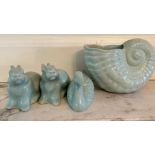 A selection of four Chinese china figures in a Celadon style glaze