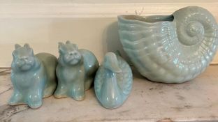 A selection of four Chinese china figures in a Celadon style glaze