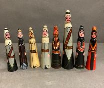 A set of eight hand painted wooden Arabic figures