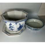 A blue and white plant pot and one footed dish