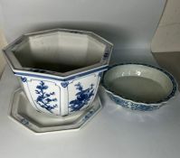 A blue and white plant pot and one footed dish