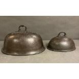 Two antique pewter cloches