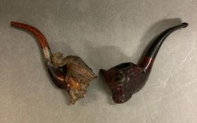 Two novelty carved pipes, depicting a bull and a sailor
