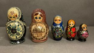 A selection of five sets of Russian dolls