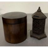 A lidded wooden box and a metal letter box style money box