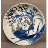 A Chinese Qing jiaqing blue and white plate with birds in copper red (Dia25cm)