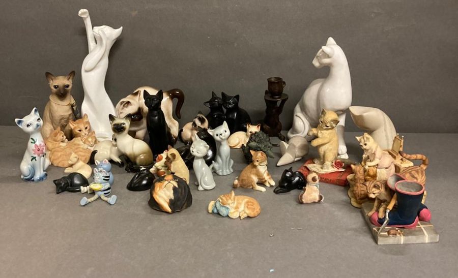 An extensive selection of ceramic and soap stone cats