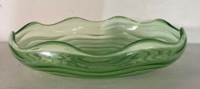 A vintage green depression glass salad bowl