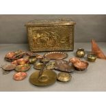 A selection of brass and copper items to include pin trays, bowls, plates and a coal scuttle