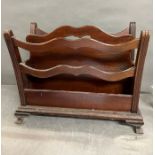 A mahogany magazine rack