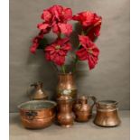 A selection of copper and brass items to include jugs, bowls and a milk churn