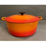 A large orange Le Creuset casserole dish (Dia 29cm)