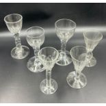 Six wine glasses with cup bowls and facet stems (Five have chips to base)