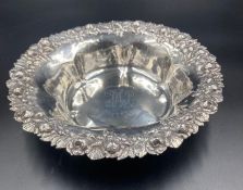 An ornate Sterling silver bowl with floral decoration to edge, approximate total weight 270g