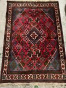 A hand knotted wool rug (160cm x 111cm)