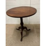 A George III style mahogany circular tripod table on three down swept legs (H74cm Dia60cm)