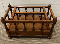 A regency style mahogany canterbury with division above on apron drawer raised on turned legs