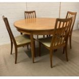 A Mid Century G-Plan circular extending dining table and four chairs (Dia120cm)
