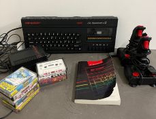Sinclair Spectrum with games, joy stick and book