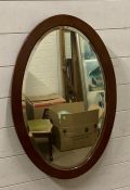 A mahogany framed oval hall mirror