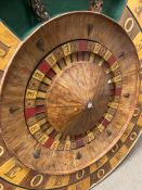 A mid century fairground odds and evens turn table. Diameter 126cm