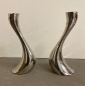 A pair of chrome Georg Jensen candle sticks 20 cm High