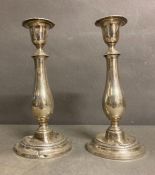 Pair of Sterling silver candlesticks AF, cement filled, approximately 24.5 cm in height.