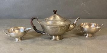 A three piece silver tea service by Edward Barnard & Sons Ltd, hallmarked for London 1908 in an