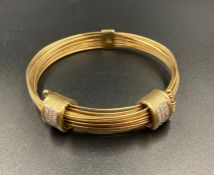 A Links gold bangle with two matching pave diamond style fasteners (Approximate total weight 46.5g)