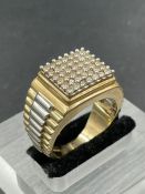 A 9ct gold Gents ring with a total of 1ct of diamonds. (Approximate Total Weight 11.3g) Size V