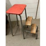 A vintage kitchen stool with fold our steps