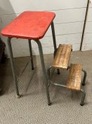 A vintage kitchen stool with fold our steps