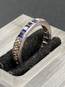 A diamond and sapphire eternity ring.(Size L)