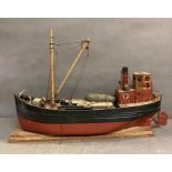 A hand painted model of a north sea trawler on plinth