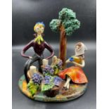 A Neuquelman of Paris figurine of a couple picking grapes