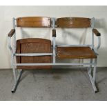 A vintage theatre seats, metal frame with wooden flip seats