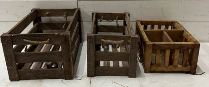 Three wooden crates with rope handles