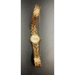 A 9ct gold 21 Jewels Rotary ladies watch on 9ct gold bracelet with safety chain.