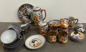 A selection of oriental theme tea sets and plates